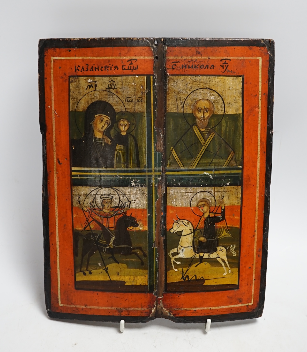 A quadripartite Russian Icon of the Virgin and Child, St. Nicholas, St. Demetrius and St. George, 27 x 22cm